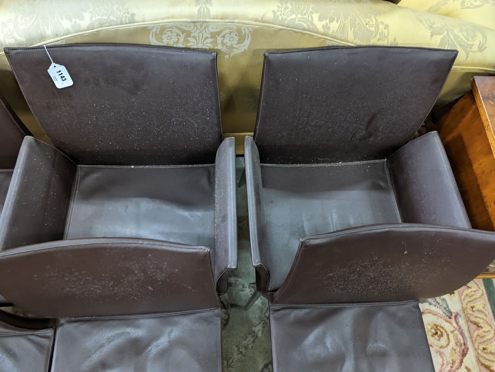 A set of six contemporary brown leather dining chairs